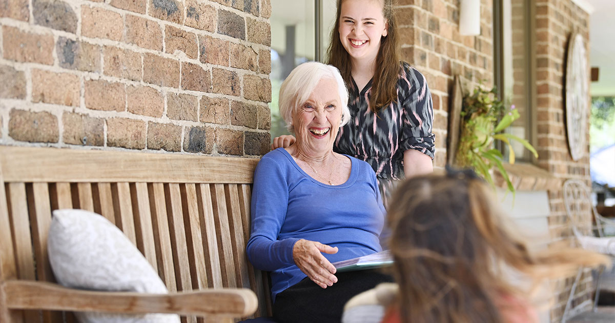 An older woman enjoying family time.